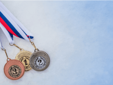 winter Olympic medals on ice