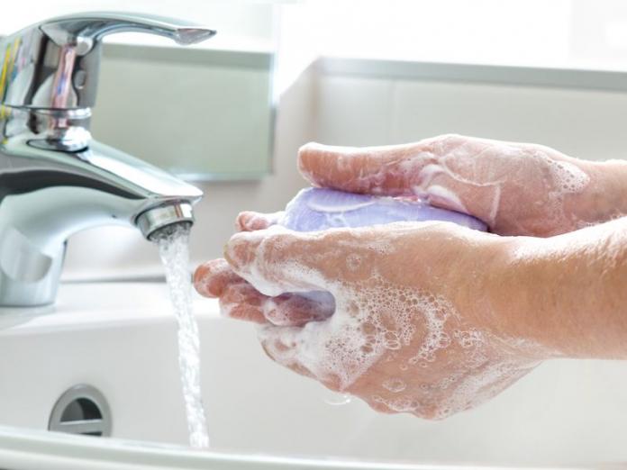 a person washing hands, which is what you should do to prevent infectious diseases like the coronavirus
