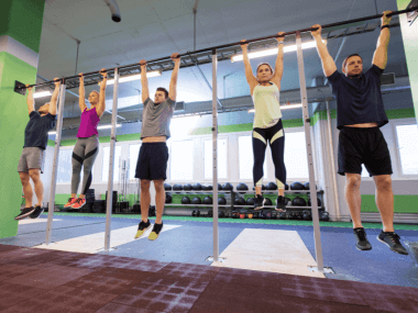 Photo of people hanging from a bar