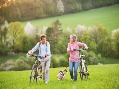 senior couple with companion dog