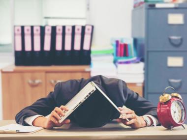 man asleep at his desk