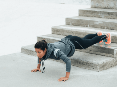 Photo of a woman doing a pushup variation