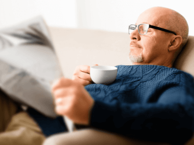 senior man reading newspaper