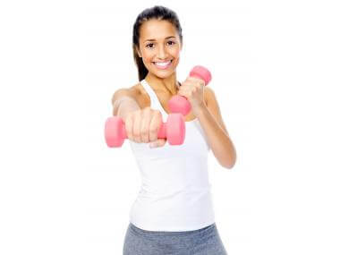 Woman doing exercise with dumbbell
