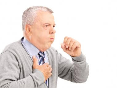 man coughing