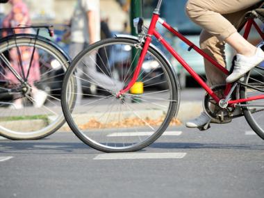 A person riding a bicycle on a sunny day