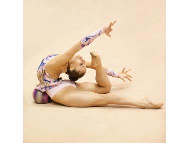 Woman doing Rhythmic gymnast demonstrating a stretching pose