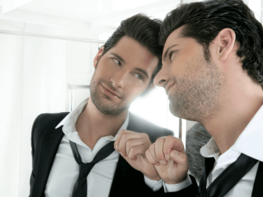 fist bumping self in mirror