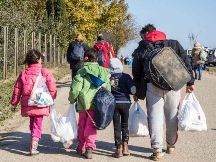 Photo of a family carrying shopping bags