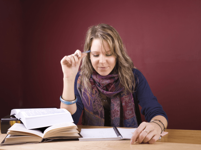 Student researching for and writing essay