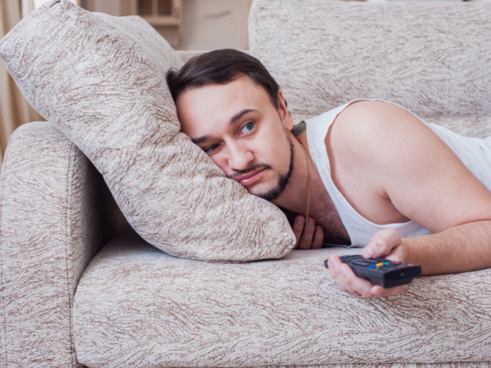 Lazy guy laying on couch