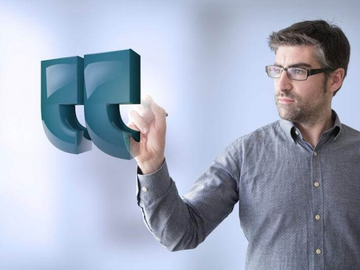 A man pointing at an unquote (or is that an end quote?)