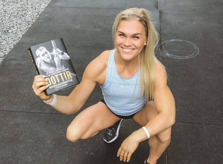 Photo of Katrin holding her book