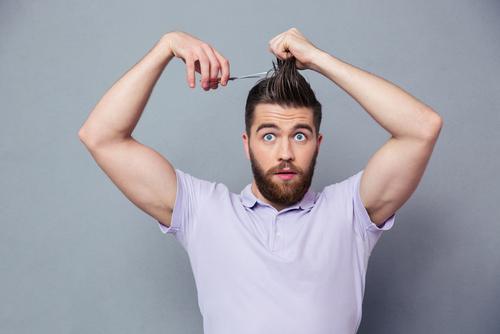 man impulsively cuts own hair