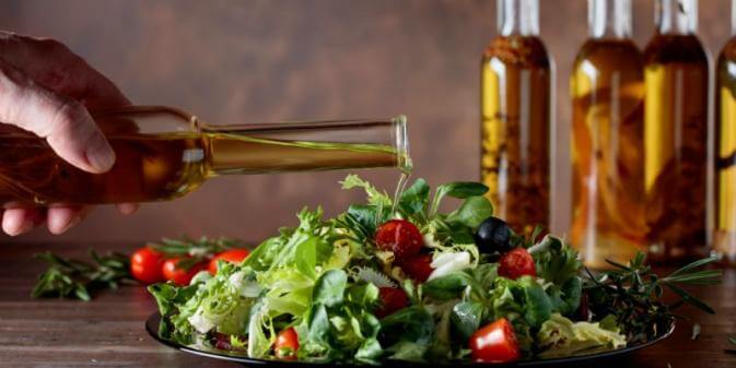 olive oil and salad representing a mediterranean diet 