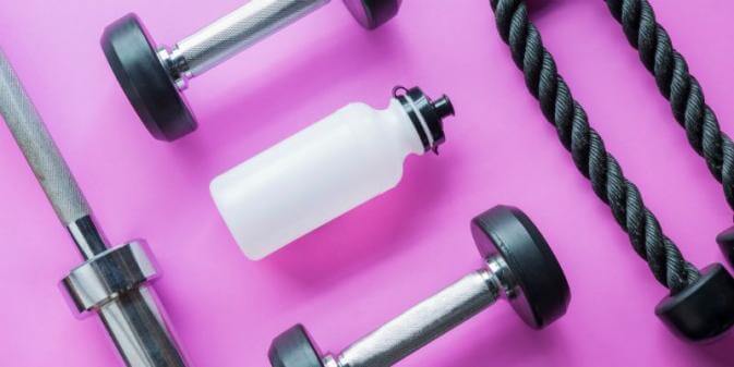 image of a water bottle with weights and exercise equipment
