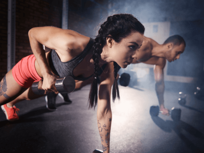 Photo of two people doing a push-up row