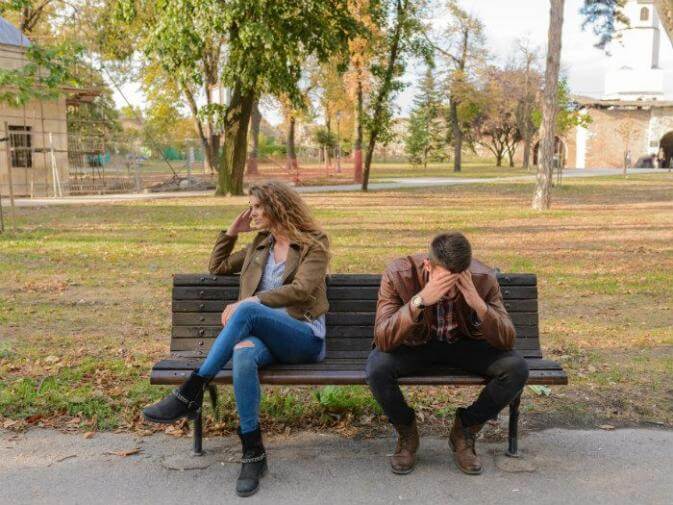 image of a couple fighting on a bench