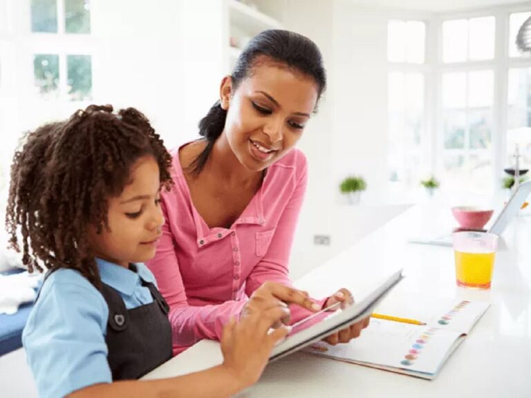 Mother and child looking at an electronic tablet