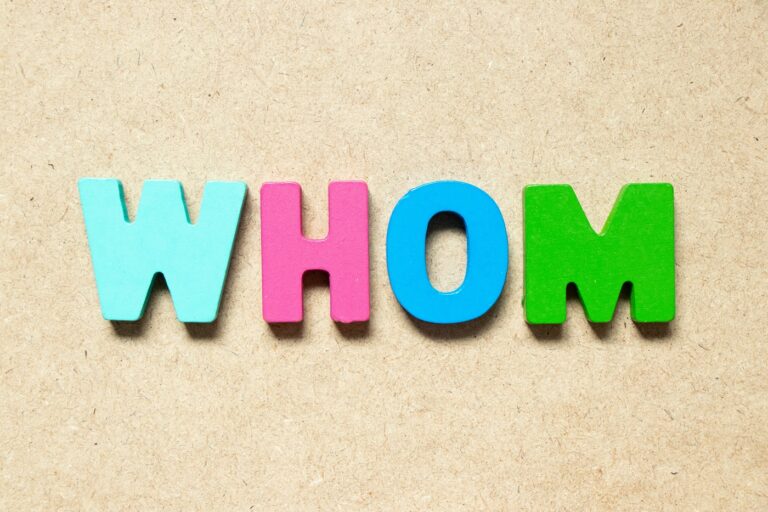 The word 'whom' spelled in colorful letters.