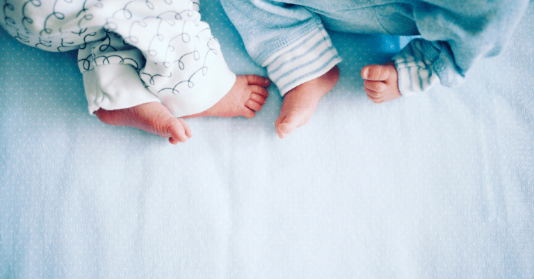 babies lying down in the bed