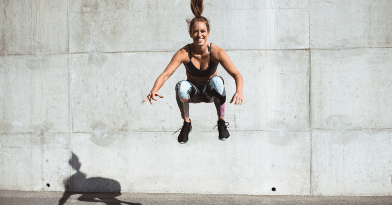 a woman jumping up high