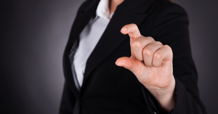 a woman holding up her fingers to show an amount