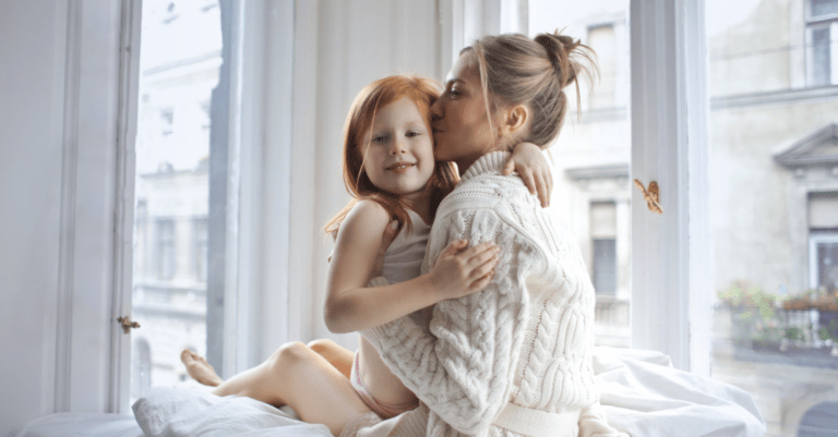 a mother and daughter hugging