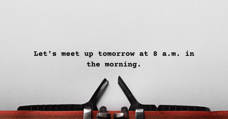A sheet on a typewriter that has words on it that read "Let's meet up tomorrow at 8 a.m. in the morning."