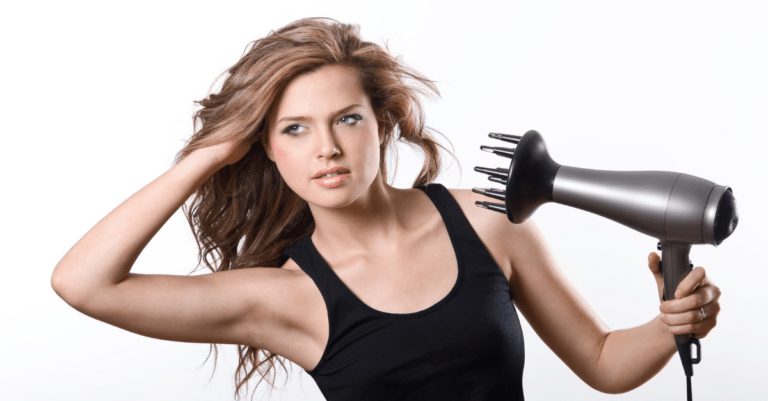 a woman blow-drying, diffusing, and fluffing her hair