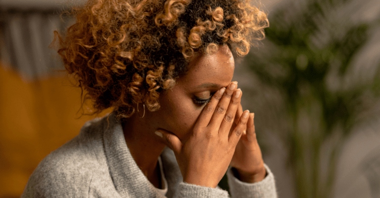 a woman who looks like she is stressed or thinking