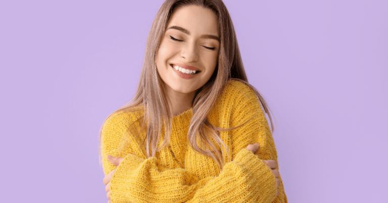 a girl hugging herself