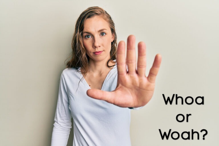 A woman holding her hand out as if to say, "Whoa!"