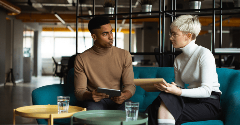 two people discussing in an office setting