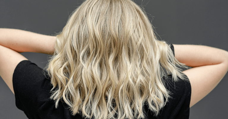 a woman turned around showing her blonde hair