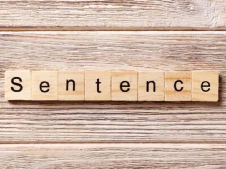 Scrabble tiles that say "sentence"