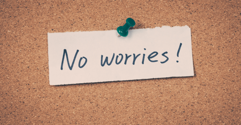 a note that says "no worries" pinned to a bulletin board
