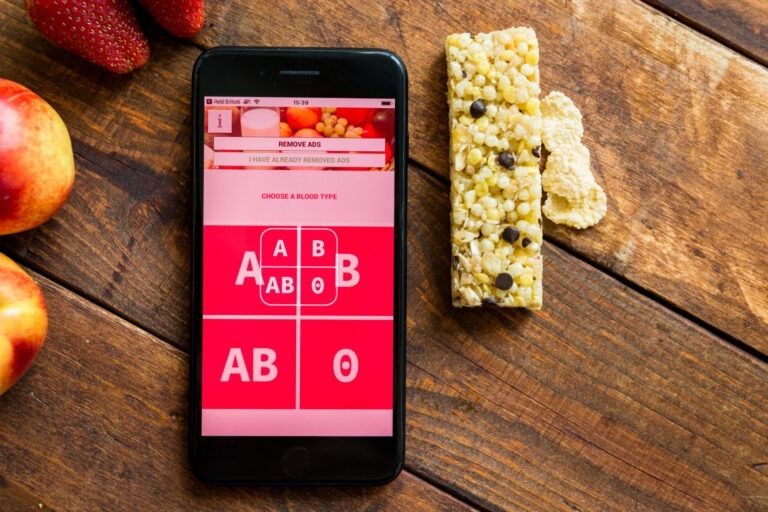 Cell phone with blood types listed next to granola bar