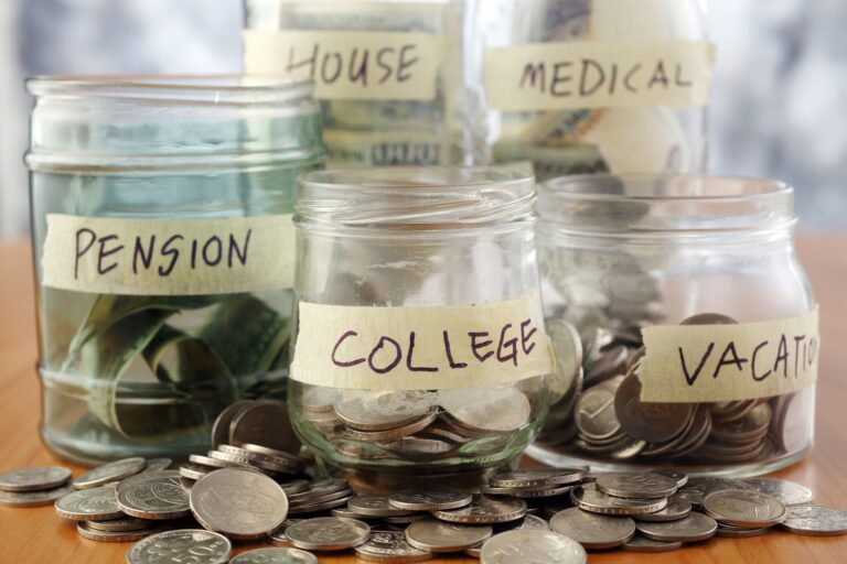 Five jars of coins to show savings accounts.