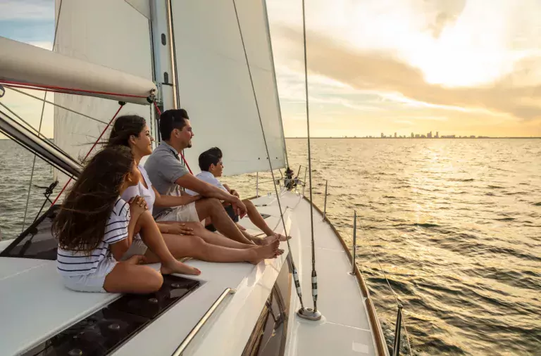 Hispanic family on a yacht, representing generational wealth