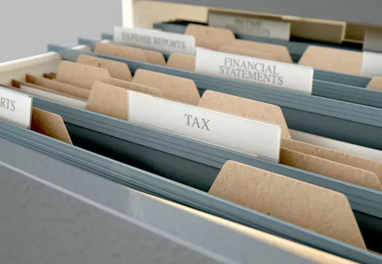 A 3D render closeup view of an open filing cabinet drawer revealing income tax related documents inside