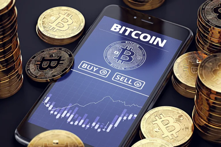 Smart phone with Bitcoin logo on it and gold coins surrounding