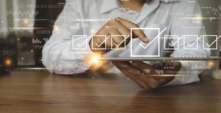 Woman sitting at a table, graphics of checkboxes overlay her hands.